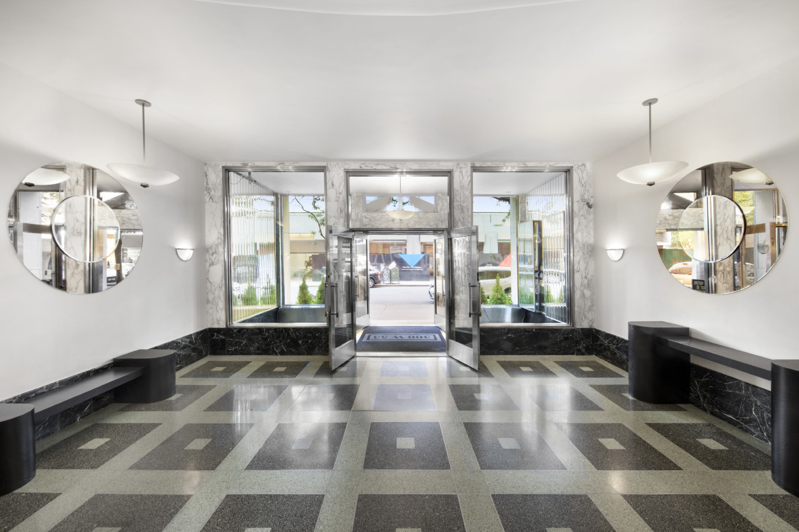 300 West 53rd Street, Unit 3C Manhattan, NY 10019 - Photo 8 of 10 a living room with furniture fireplace and flat screen tv