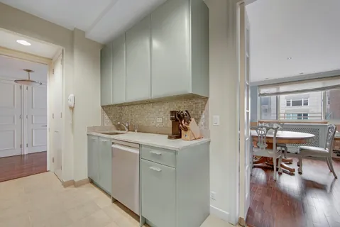 a view of kitchen with furniture and wooden floor
