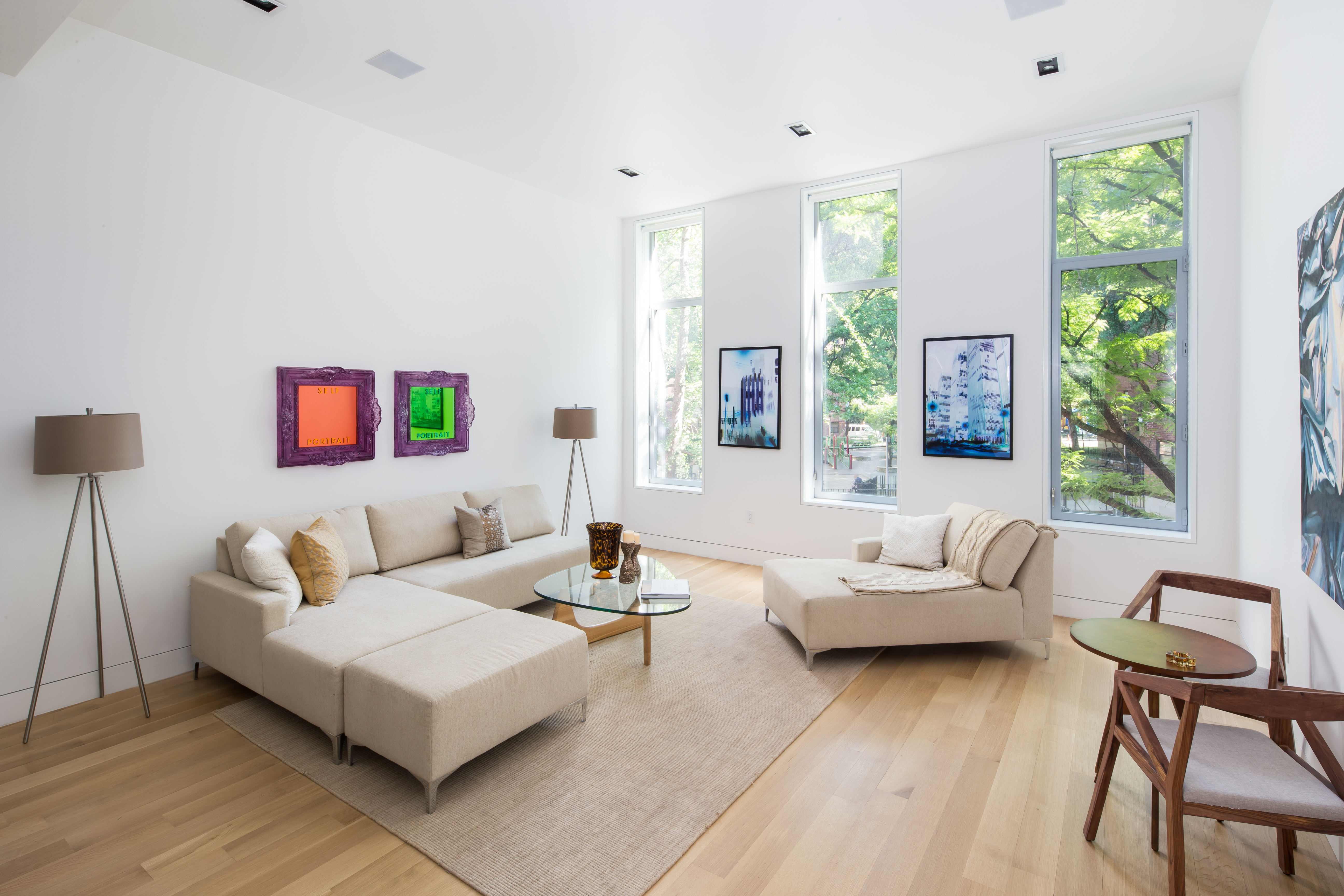 450 West 25th Street Manhattan, NY 10001 - Photo 10 of 16 a living room with furniture and a large window