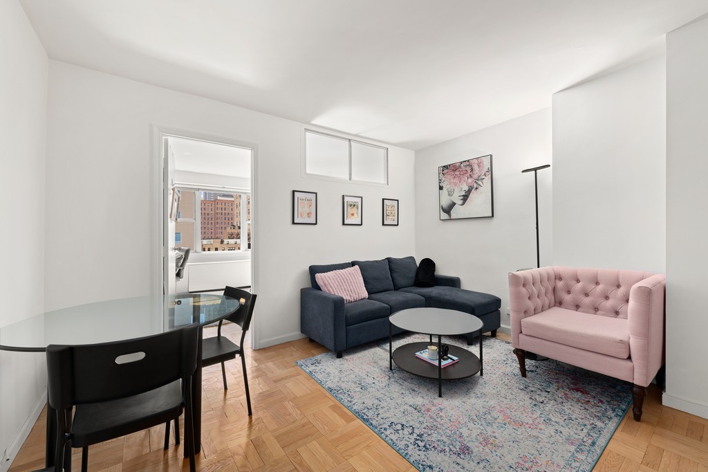 a living room with furniture and a rug