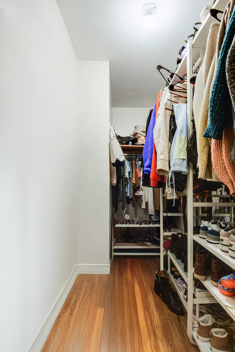 585 Warren Street, Unit 2 Brooklyn, NY 11217 - Photo 7 of 12 a view of walk in closet with clothes and shoes