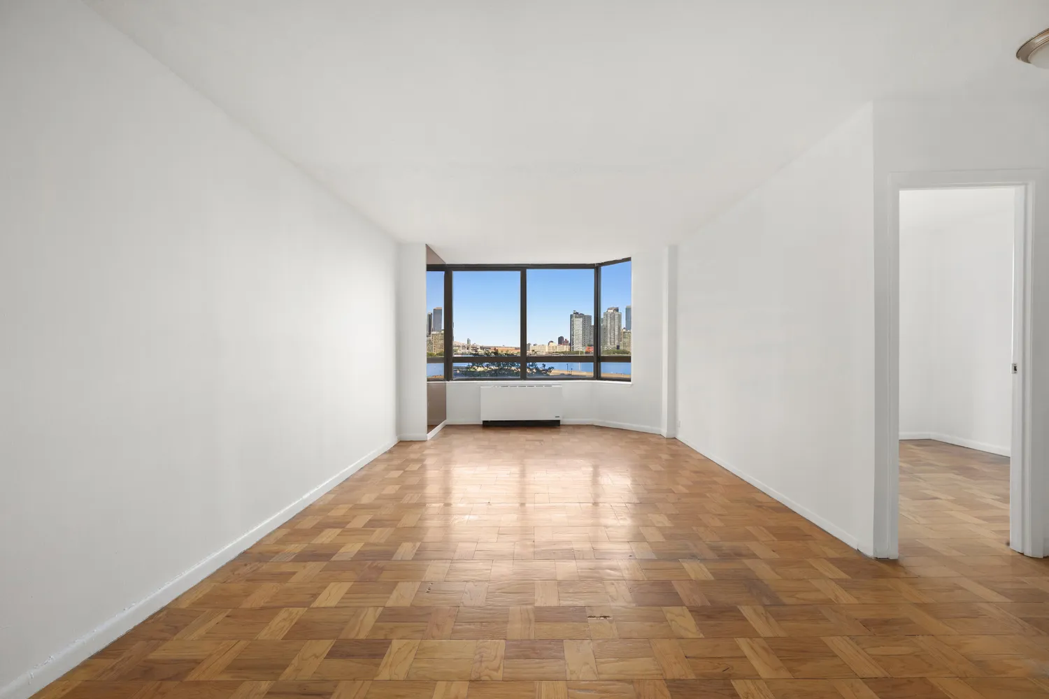 a view of a kitchen with a sink and a refrigerator