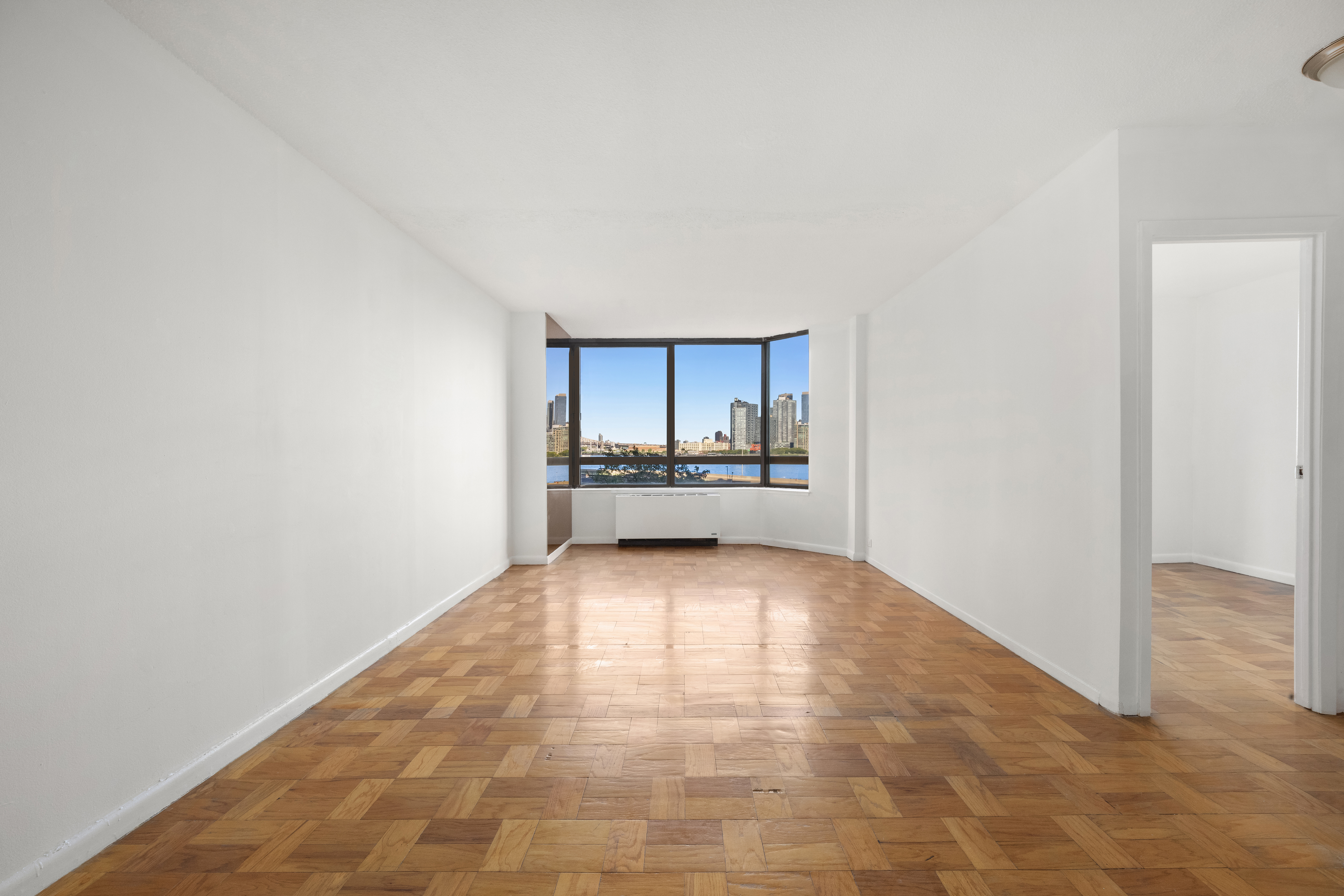 630 1st Avenue, Unit 6S Manhattan, NY 10016 - Photo 3 of 11 a view of a kitchen with a sink and a refrigerator