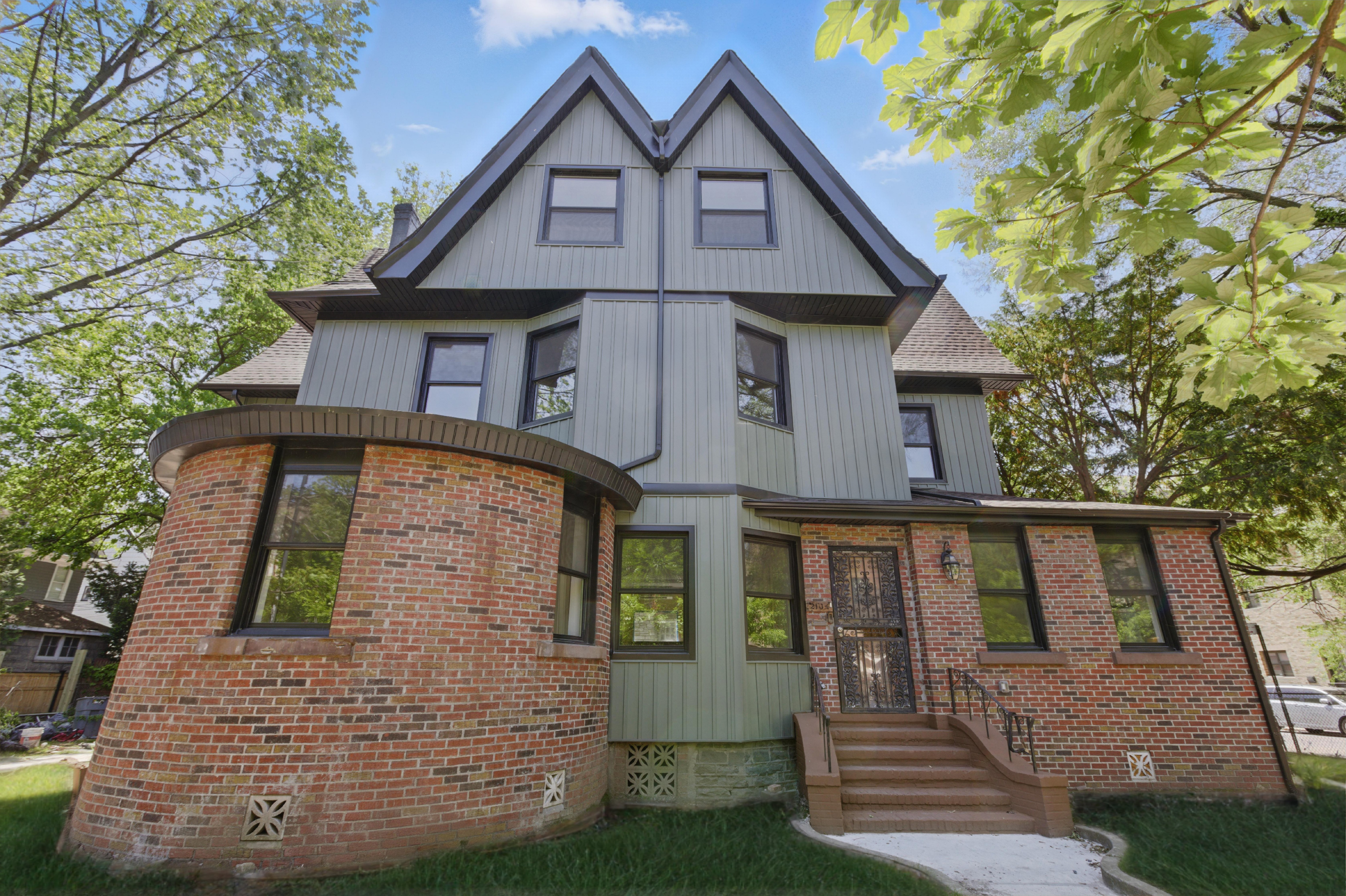 697 East 21st Street Brooklyn, NY 11210 - Photo 2 of 24 a front view of a house with a yard