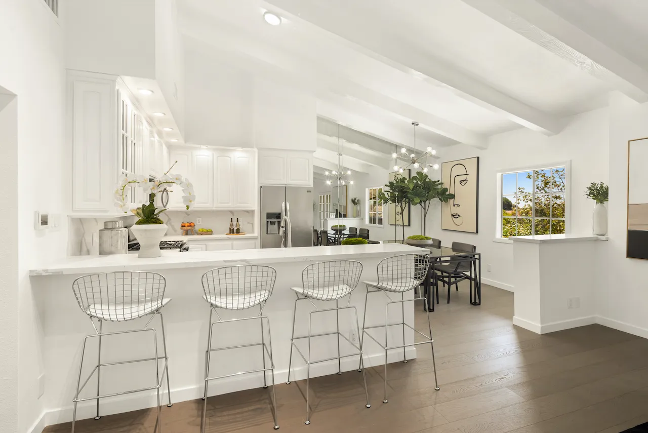 a kitchen with table and chairs