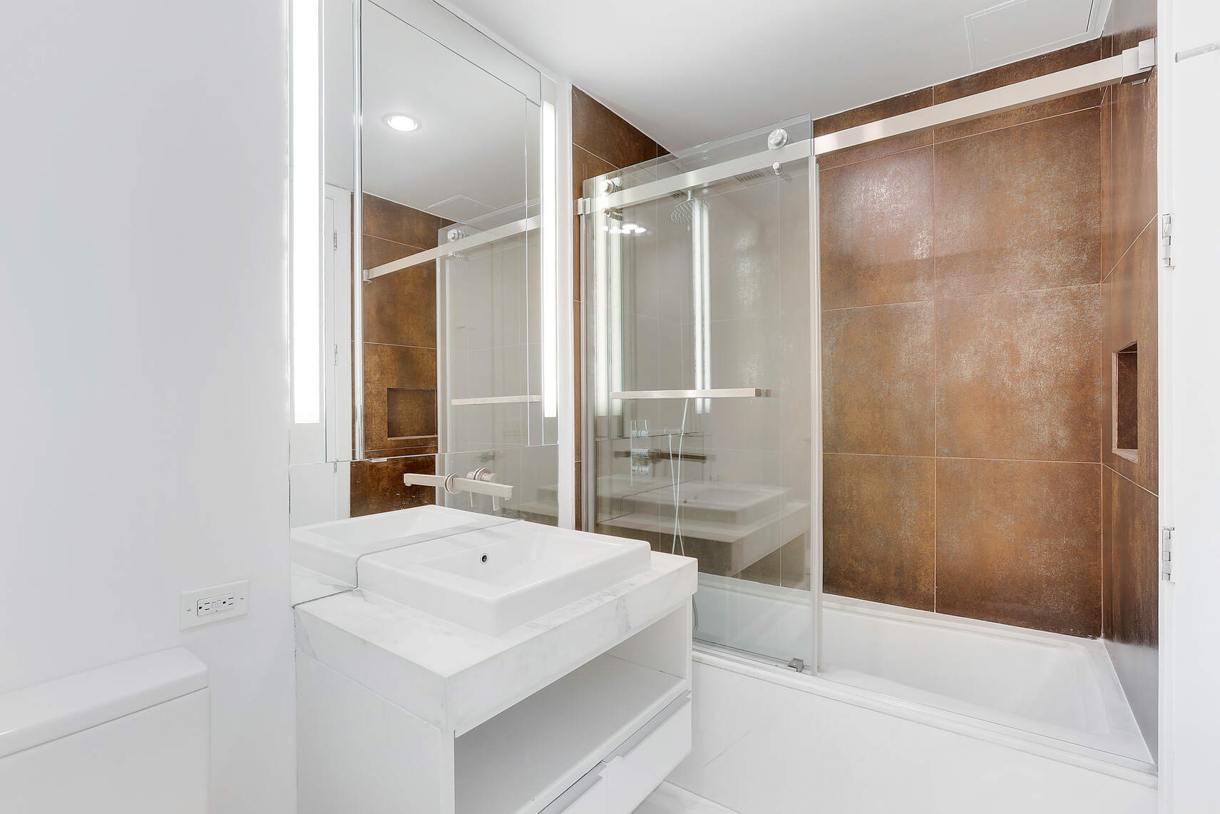 133 West 22nd Street, Unit 7H Manhattan, NY 10011 - Photo 8 of 21 a bathroom with a shower and a sink