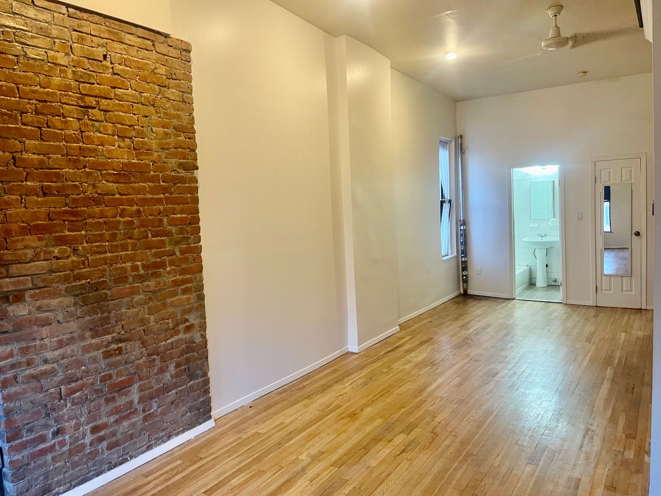1672 Park Avenue Manhattan, NY 10035 - Photo 23 of 35 a view of hallway with a wooden floor