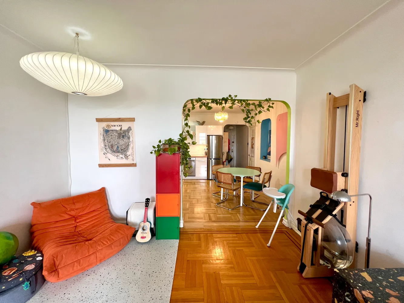 a living room with furniture a dining table and chairs