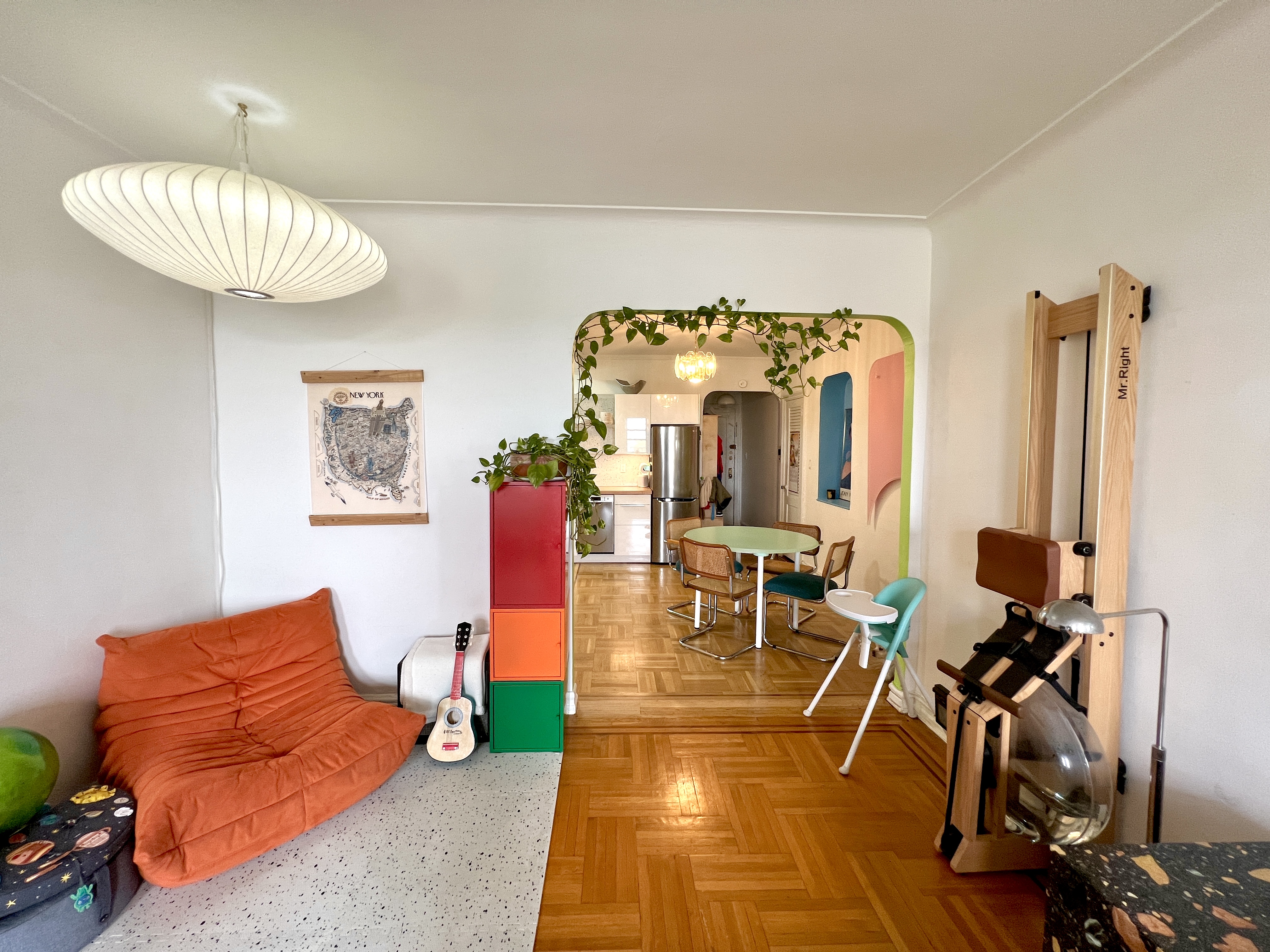909 East 29th Street, Unit 6F Brooklyn, NY 11210 - Photo 4 of 12 a living room with furniture a dining table and chairs