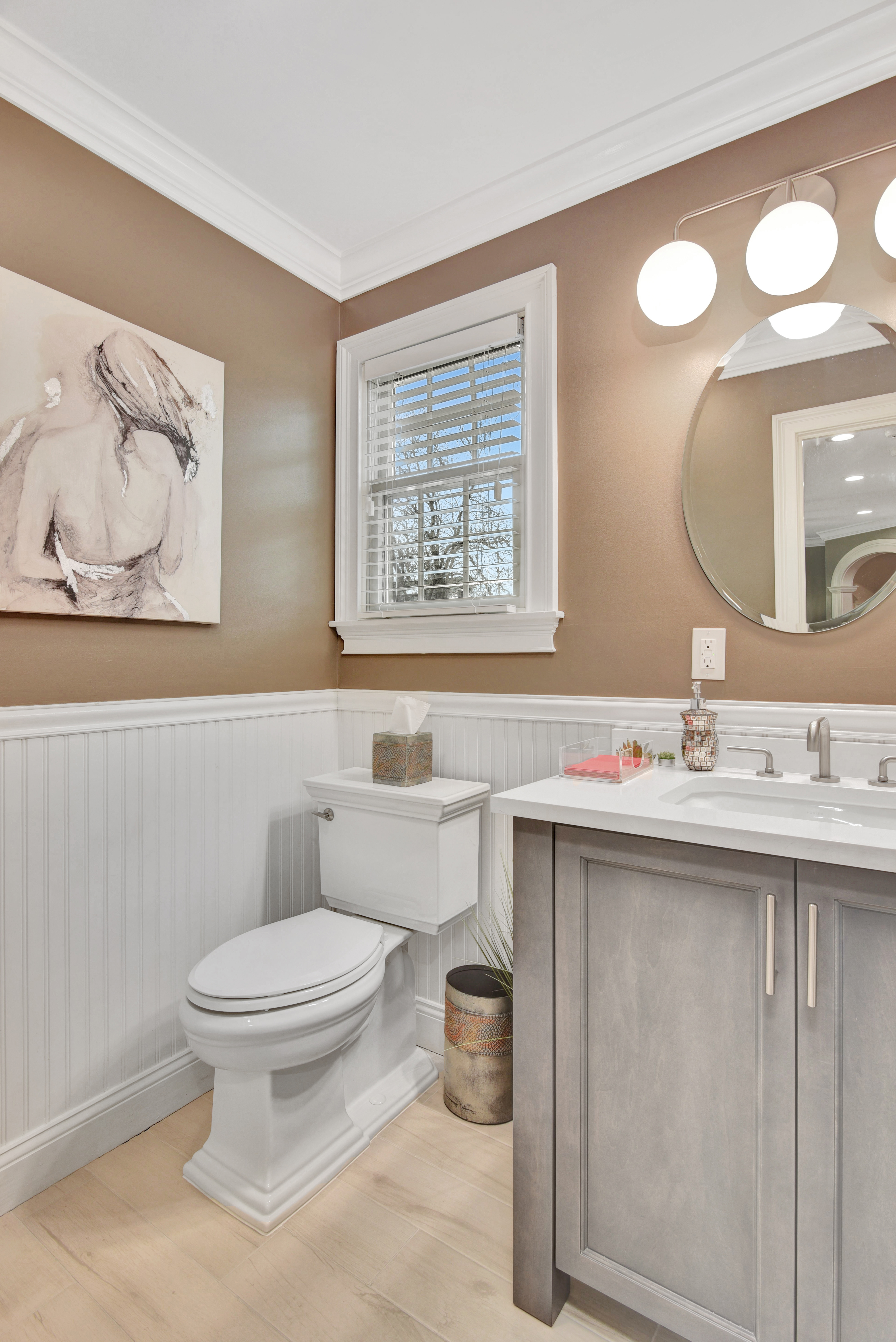 215 Lawrence Avenue Staten Island, NY 10310 - Photo 13 of 45 a bathroom with a toilet sink and mirror