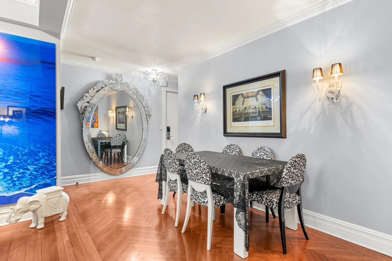 a view of a dining room with furniture and a chandelier