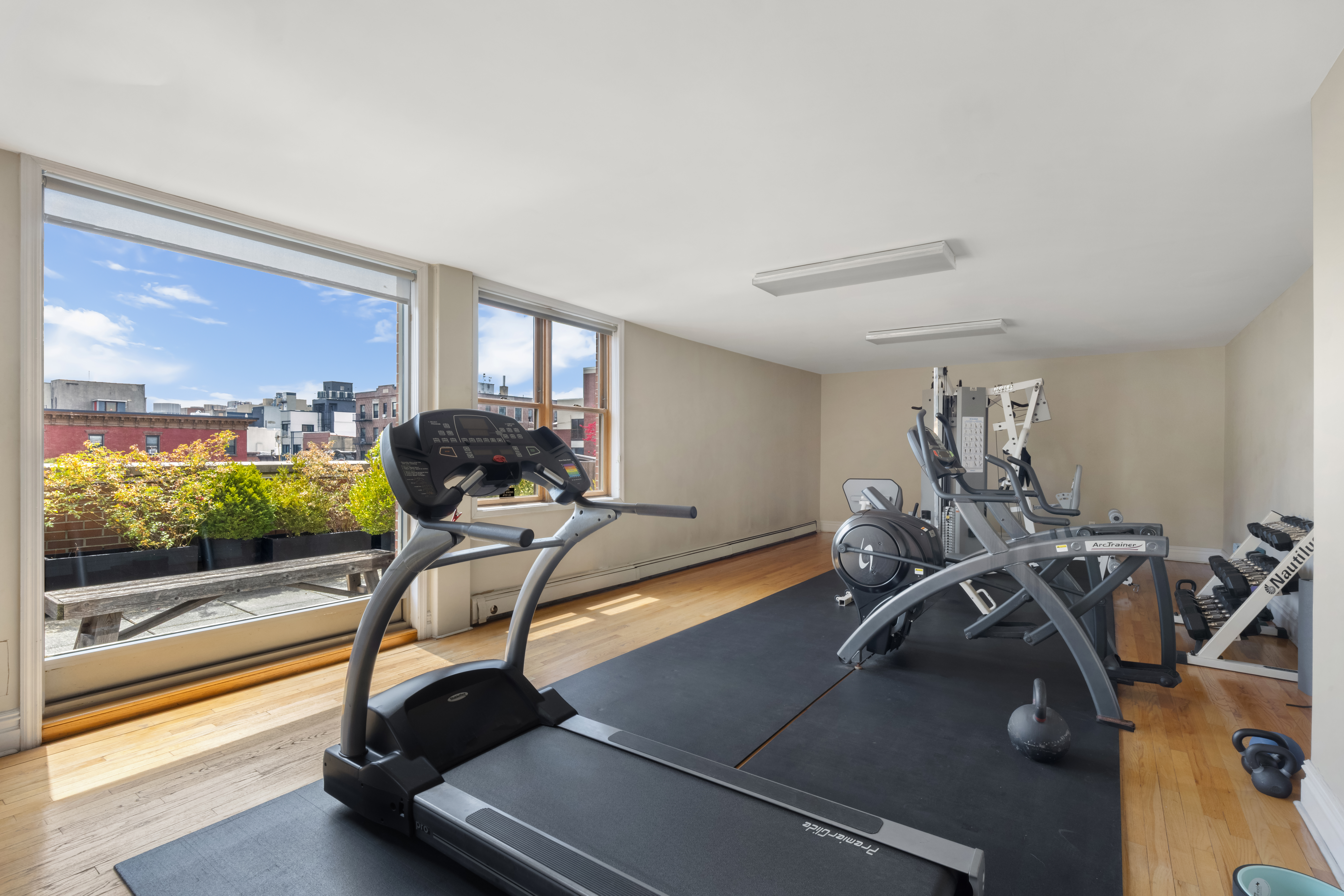 150 South 1st Street, Unit 2K Brooklyn, NY 11211 - Photo 9 of 12 a view of a room with gym equipment