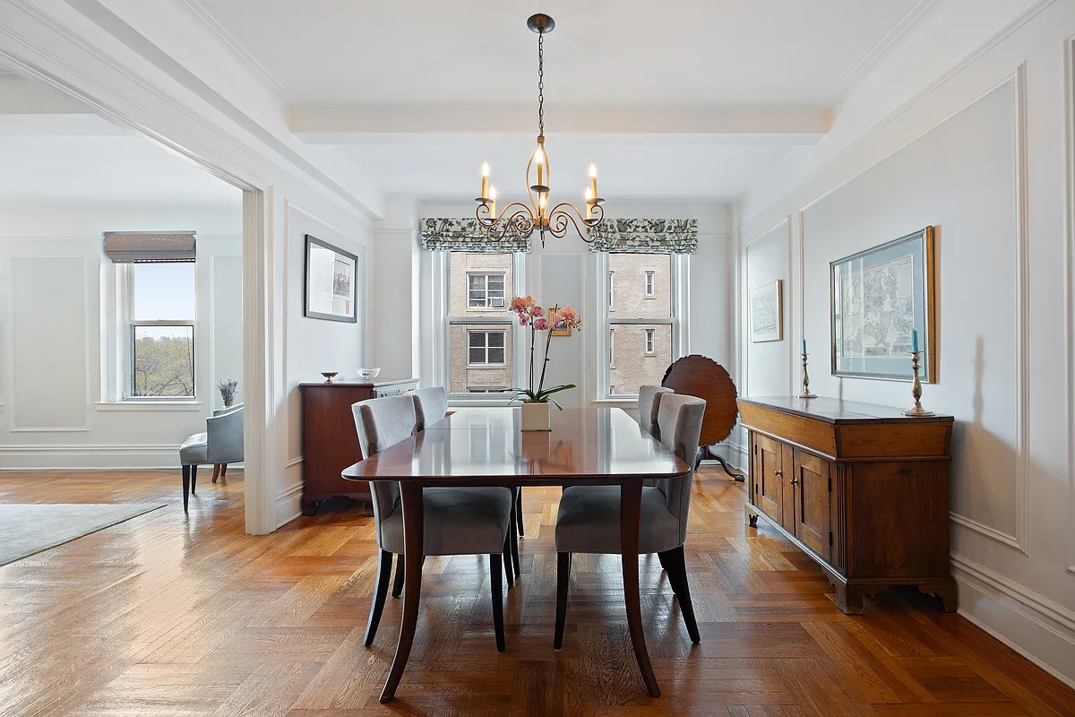 415 Central Park West, Unit 6A Manhattan, NY 10025 - Photo 8 of 25 a view of a dining room with furniture wooden floor and chandelier