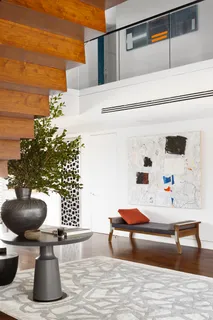 a bedroom with furniture and a potted plant