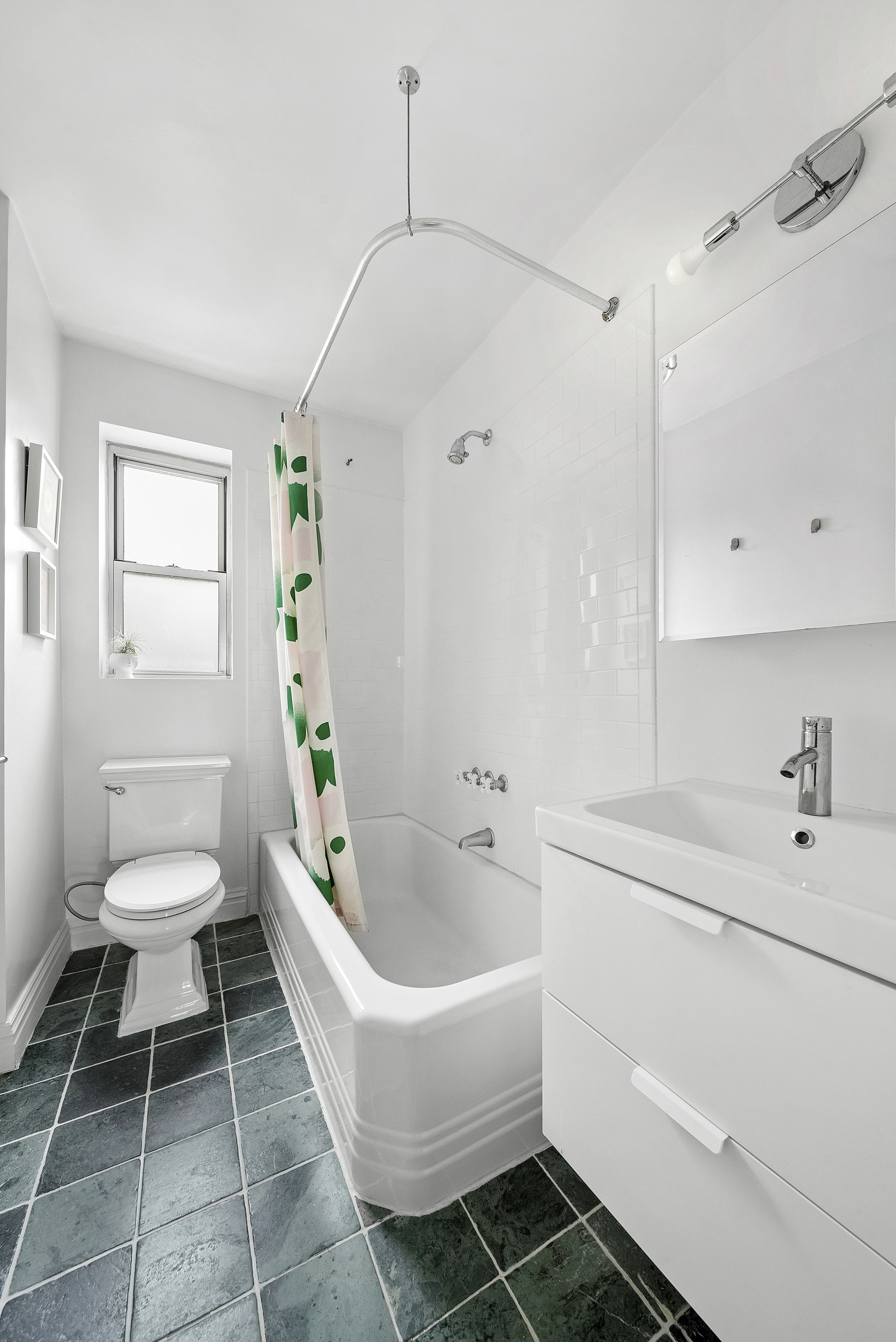 474 West 238th Street, Unit 2E Bronx, NY 10463 - Photo 6 of 13 a spacious bathroom with a sink a toilet and a bathtub