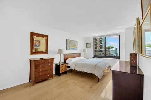 a bed room with a bed and a window