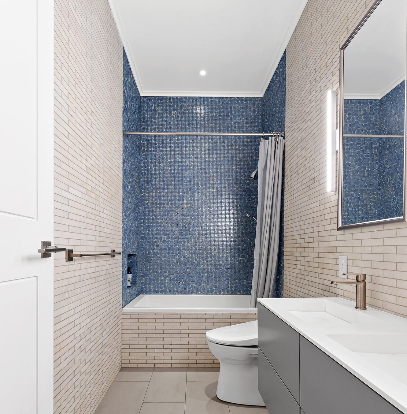 26 West 20th Street, Unit 3 Manhattan, NY 10011 - Photo 16 of 19 a bathroom with a sink a toilet and shower