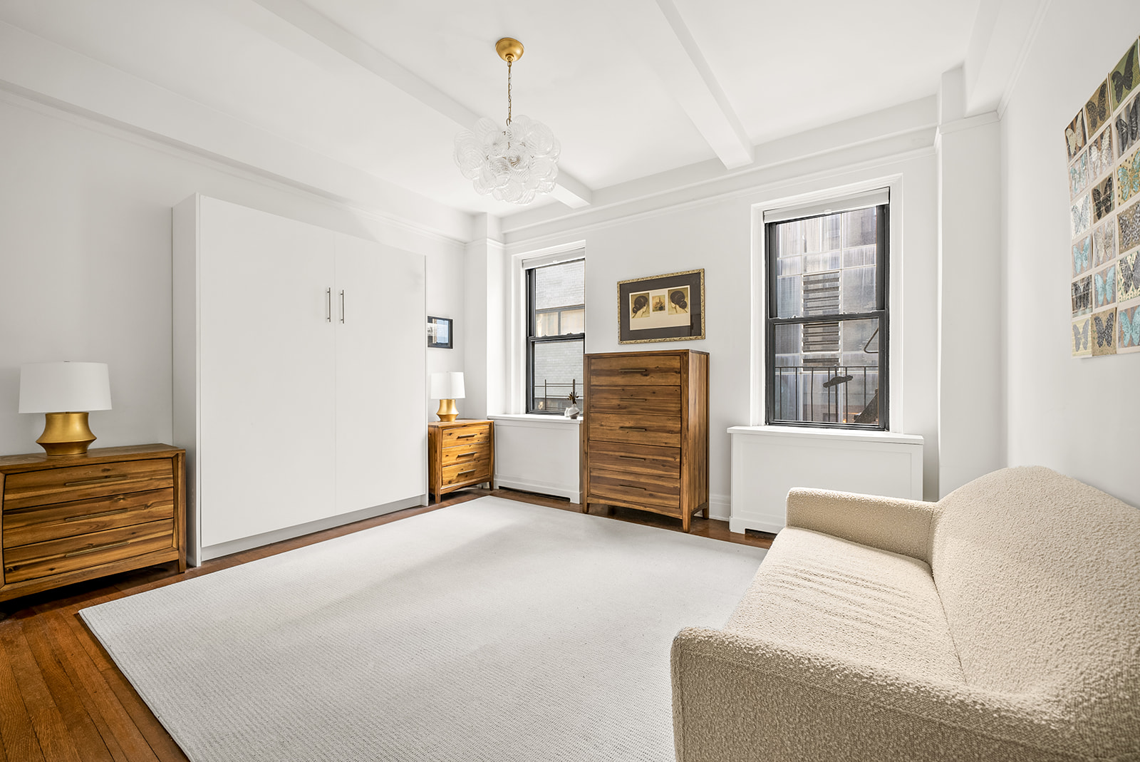 152 West 58th Street, Unit 6CD Manhattan, NY 10019 - Photo 3 of 9 a bedroom with furniture and window