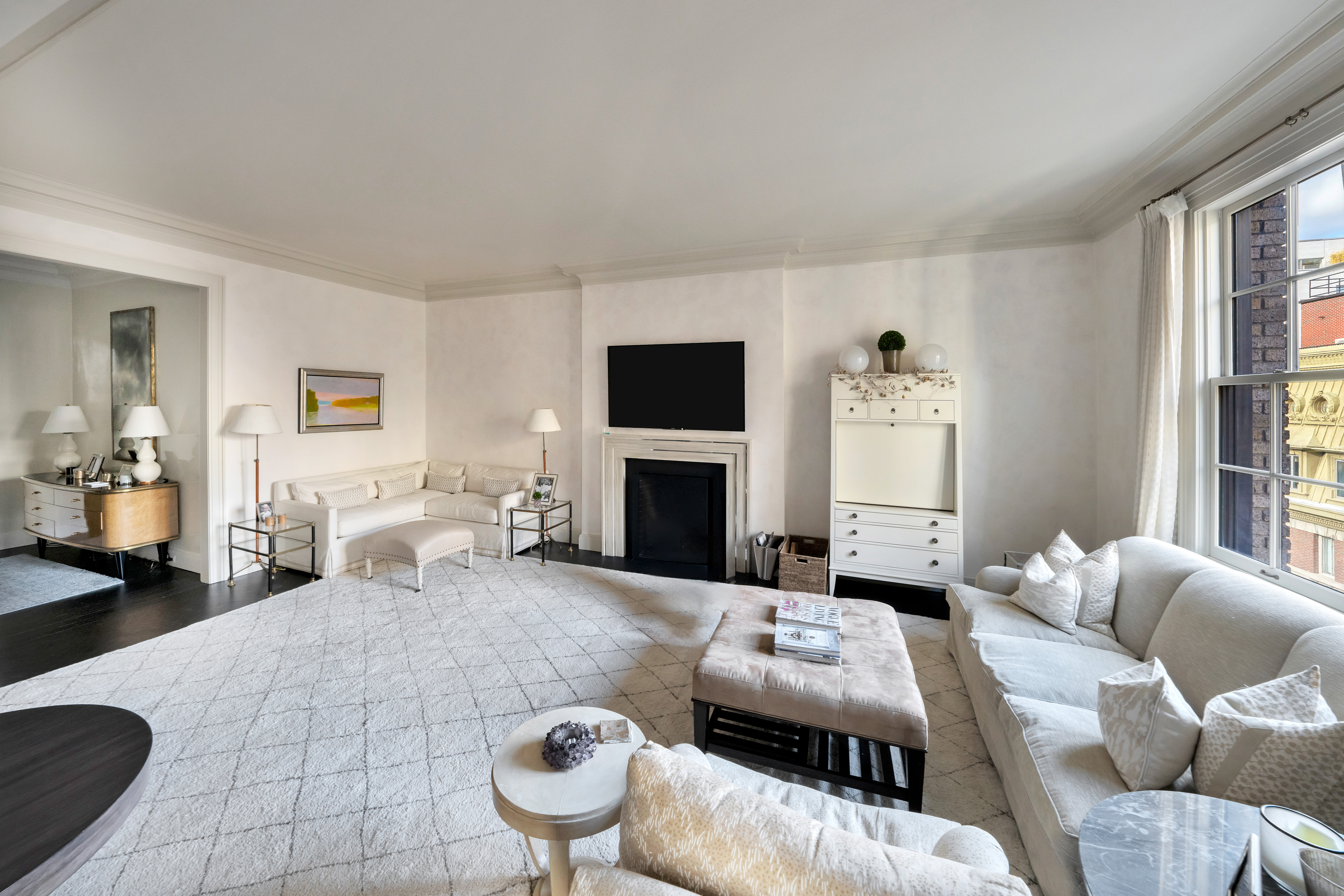 850 Park Avenue, Unit 9C Manhattan, NY 10075 - Photo 2 of 14 a living room with furniture and a fireplace