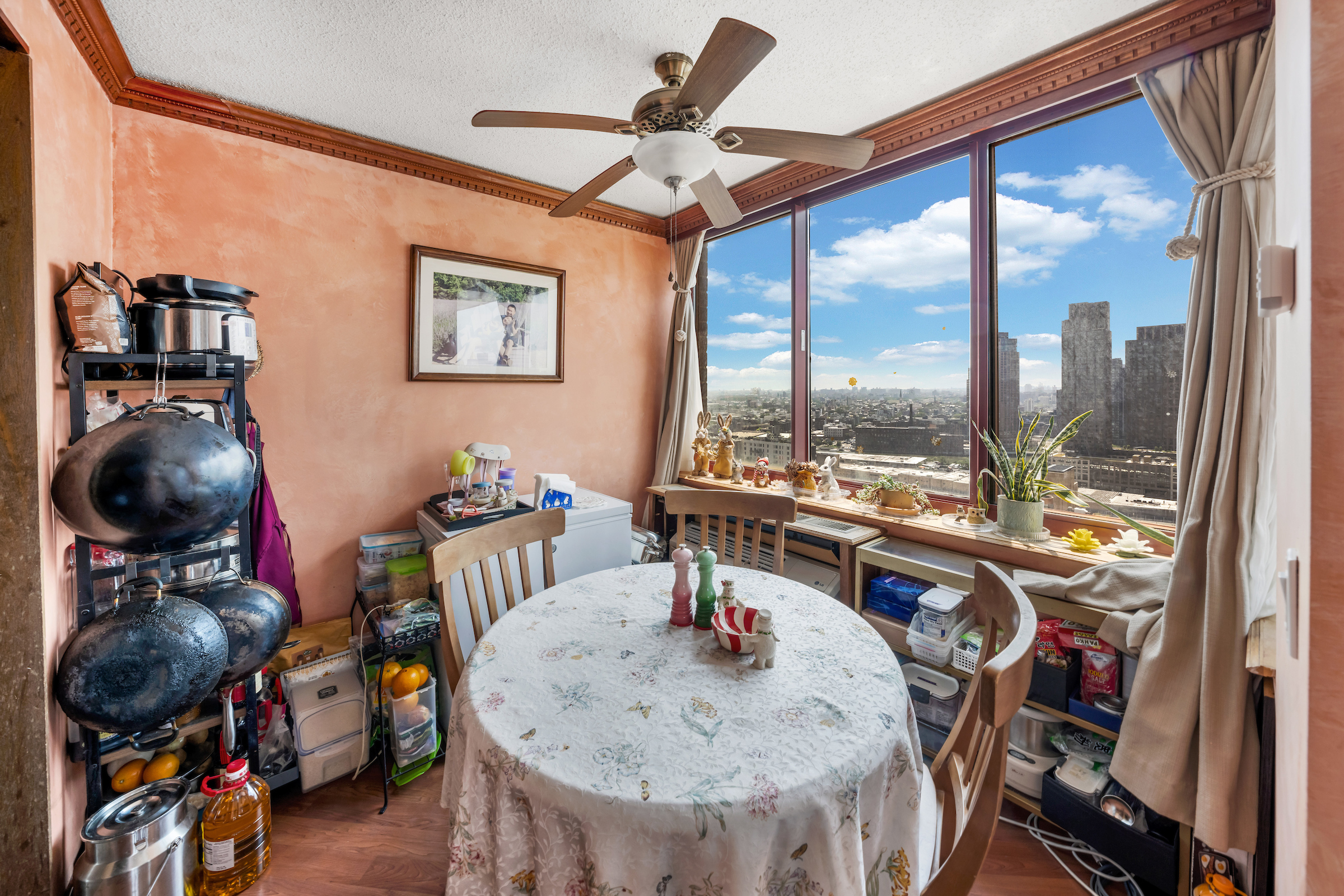4-74 48th Avenue, Unit 27A Queens, NY 11109 - Photo 8 of 17 a view of a dining room with furniture window and outside view