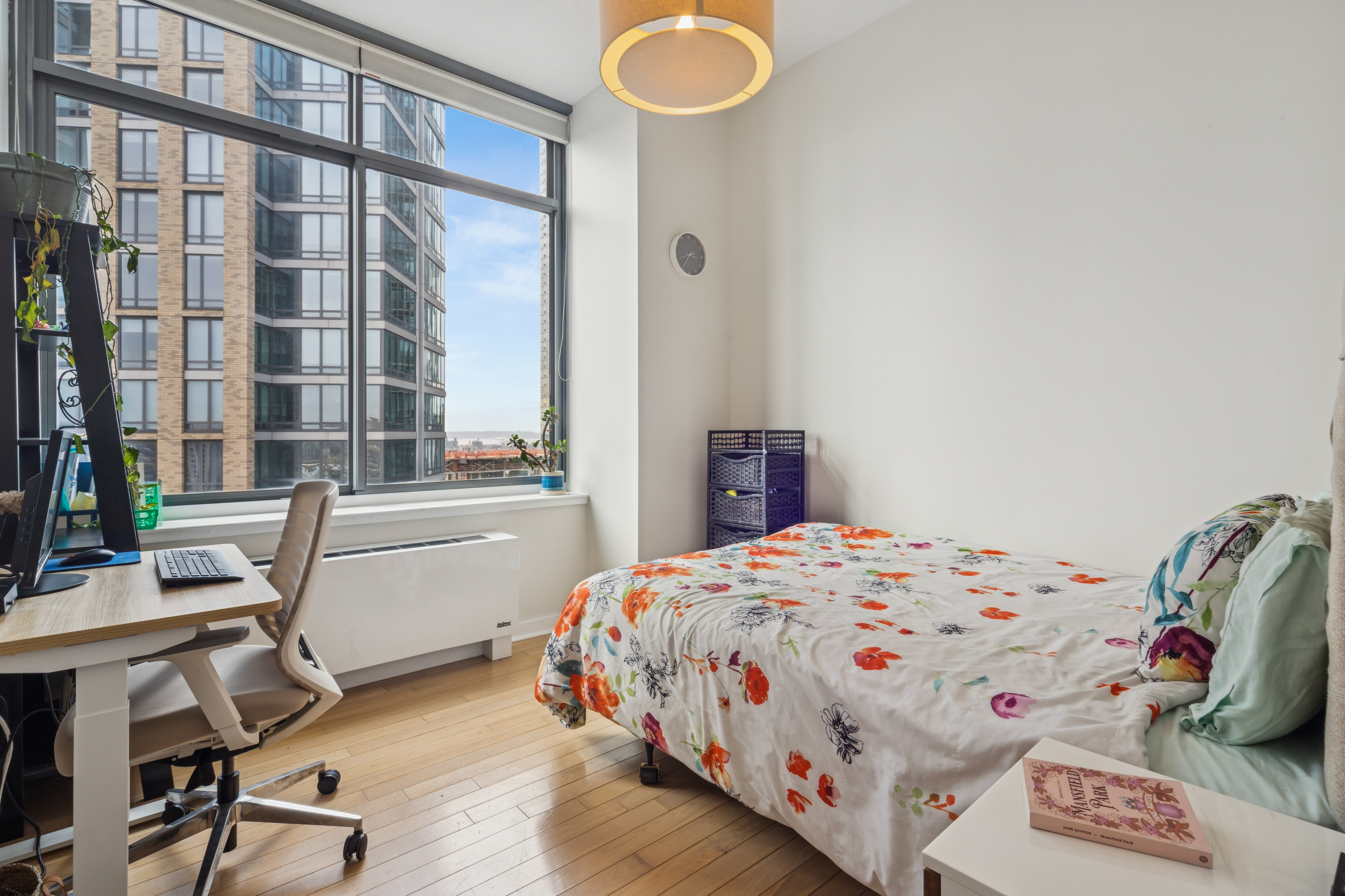 230 Ashland Place, Unit 22C Brooklyn, NY 11217 - Photo 6 of 13 a bedroom with a bed and a desk