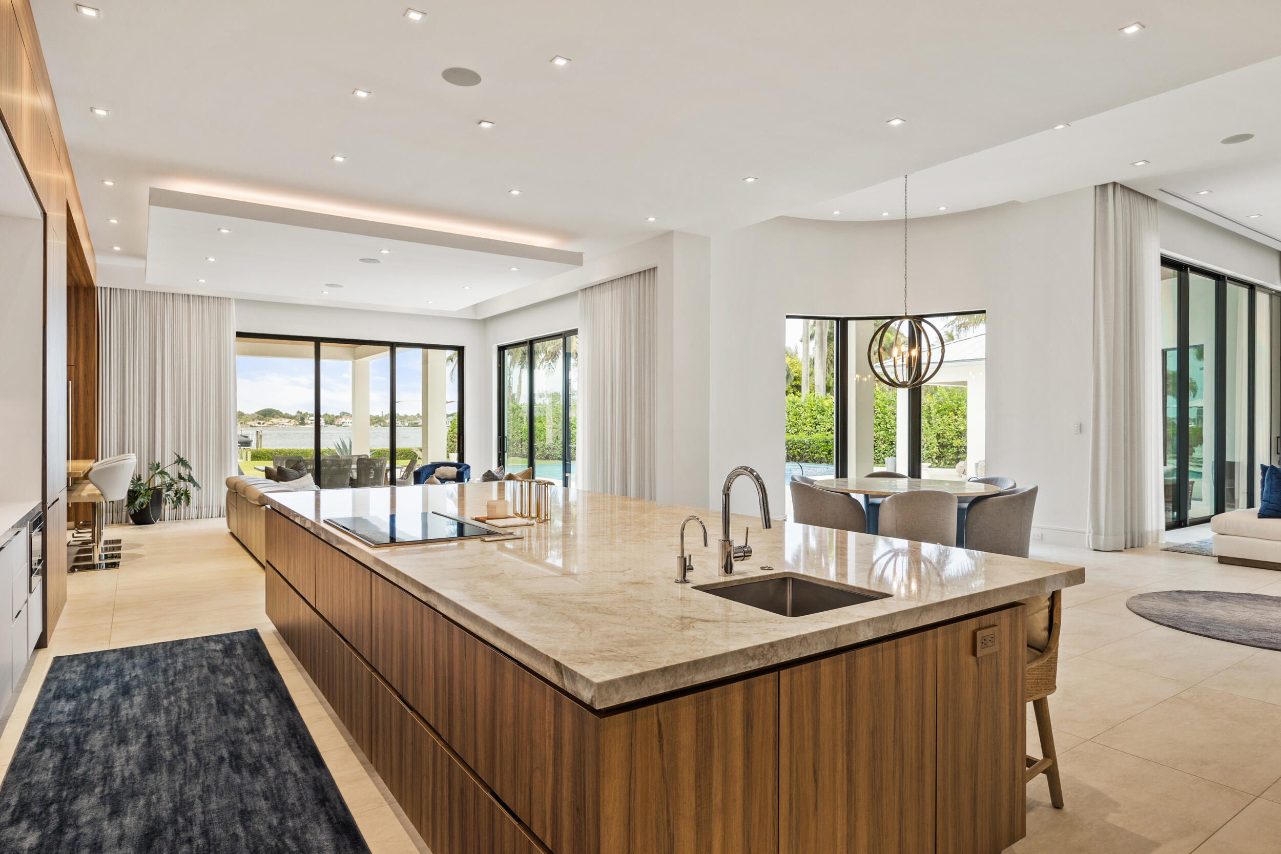 5695 Pennock Point Road Jupiter, FL 33458 - Photo 32 of 77 a large kitchen with kitchen island a large window