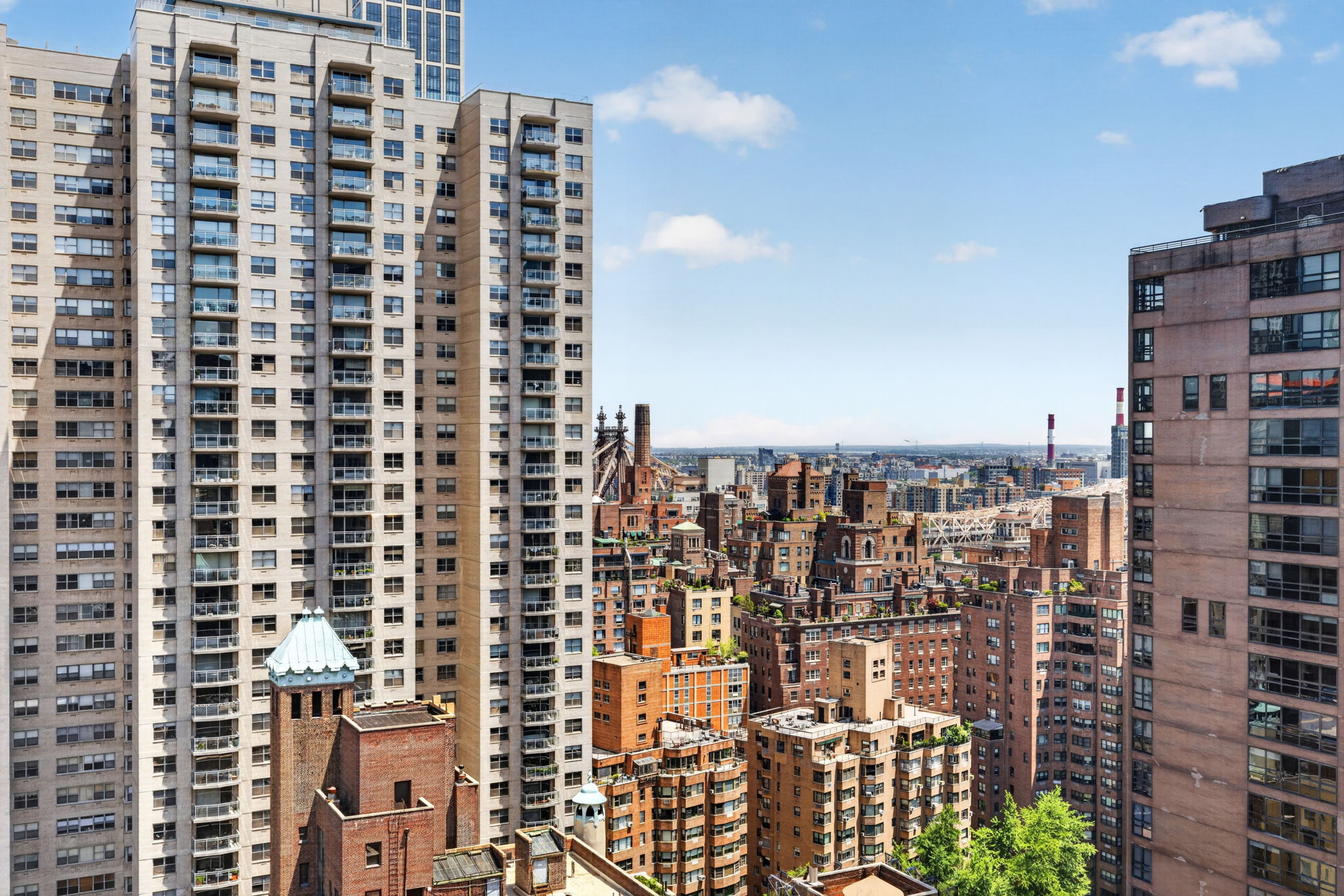 400 East 54th Street, Unit 30D Manhattan, NY 10022 - Photo 19 of 20 a city view with tall buildings