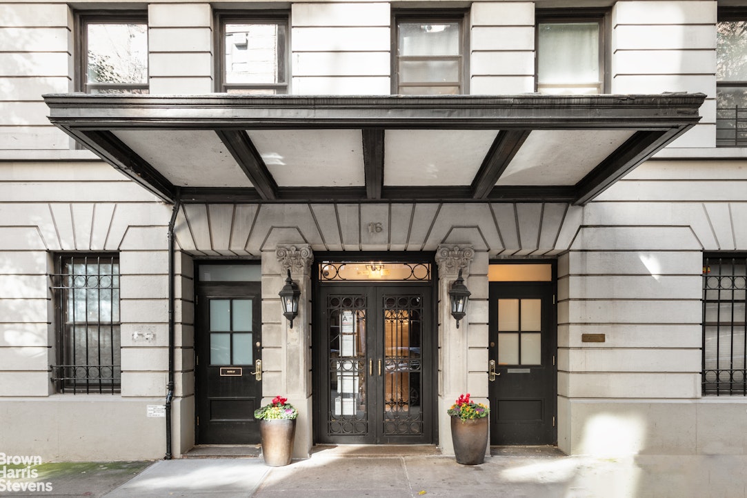 a view of porch with a table and chairs