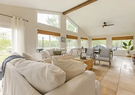 a kitchen with stainless steel appliances a refrigerator and a cabinets