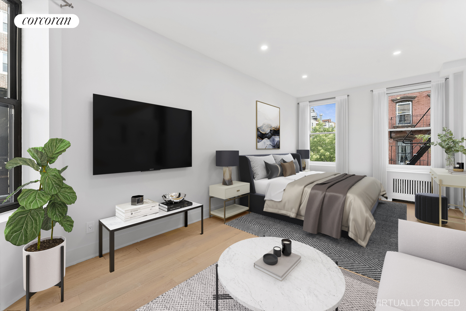 a spacious bedroom with a bed a couch and a potted plant