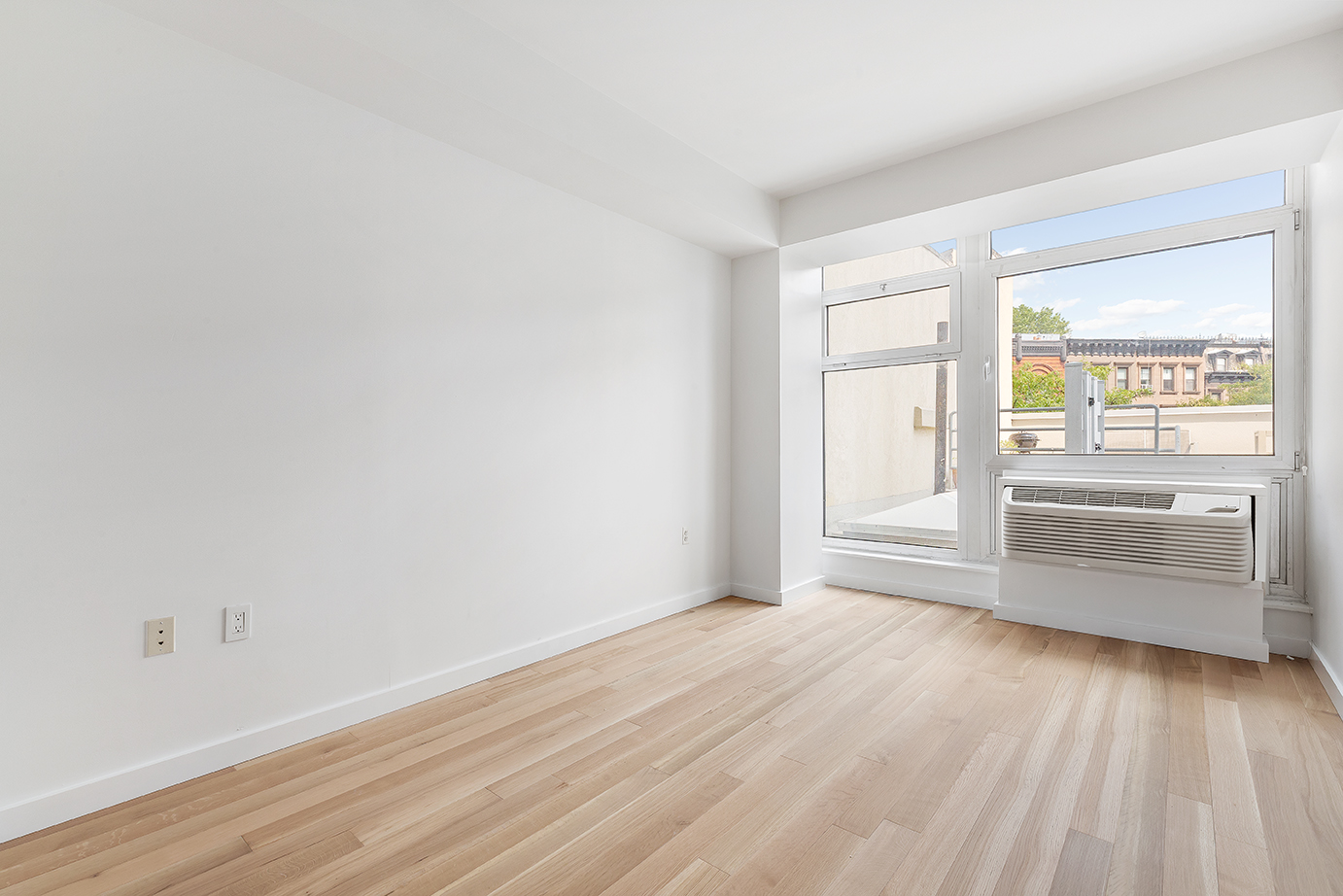 145 Park Place, Unit 3F Brooklyn, NY 11217 - Photo 6 of 9 a view of empty room with wooden floor and fan