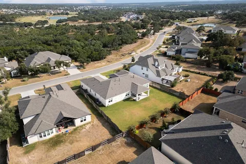 an aerial view of a house with swimming pool