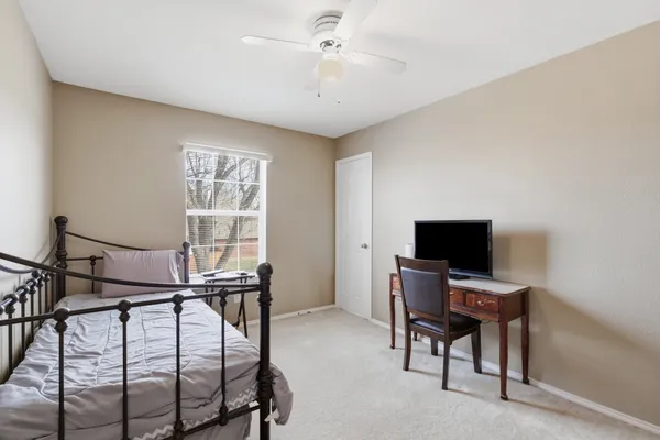 a view of a livingroom with furniture and a window