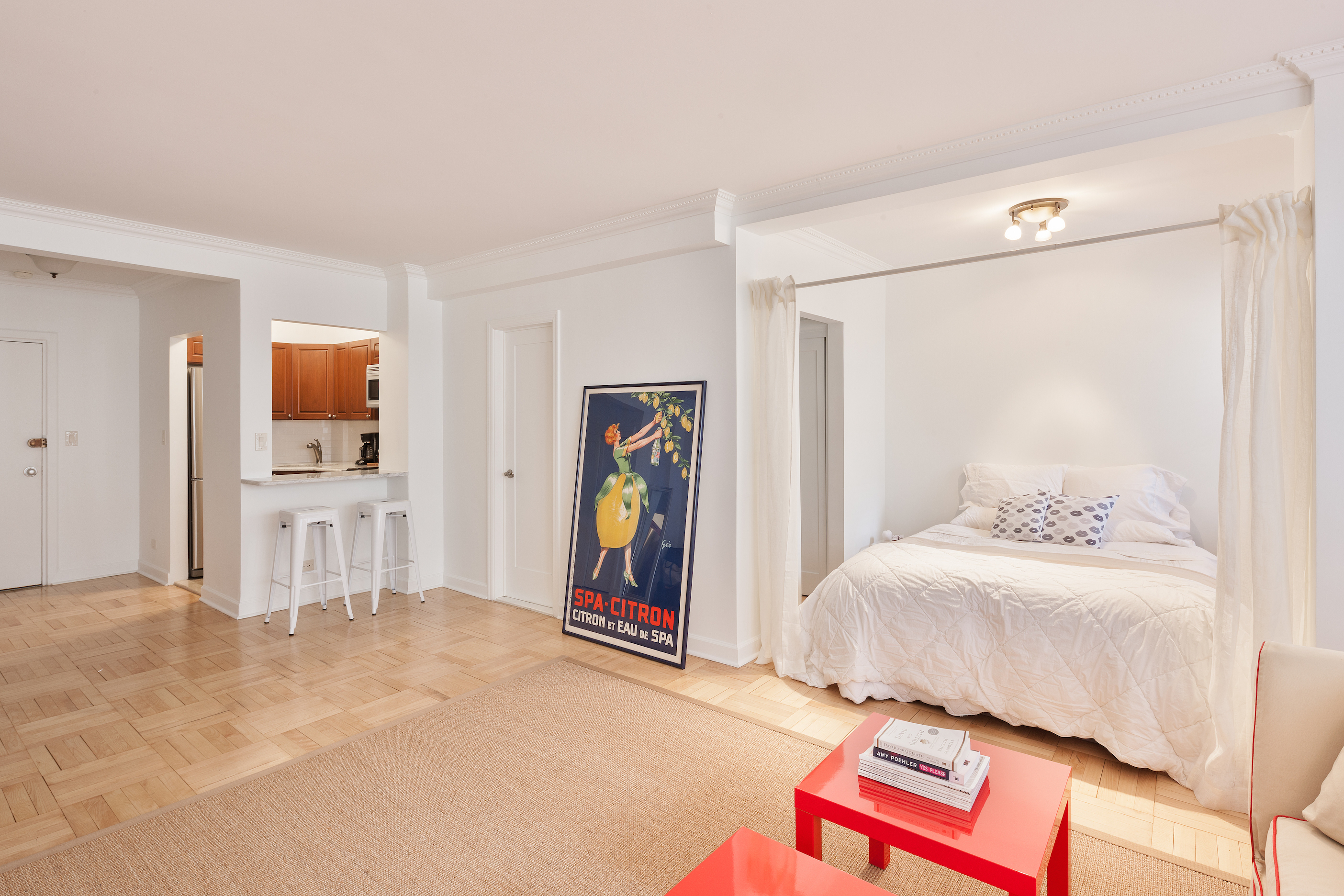 80 Park Avenue, Unit 8B Manhattan, NY 10016 - Photo 2 of 6 a bedroom with a bed and a mirror