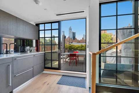 a view of a kitchen with a window