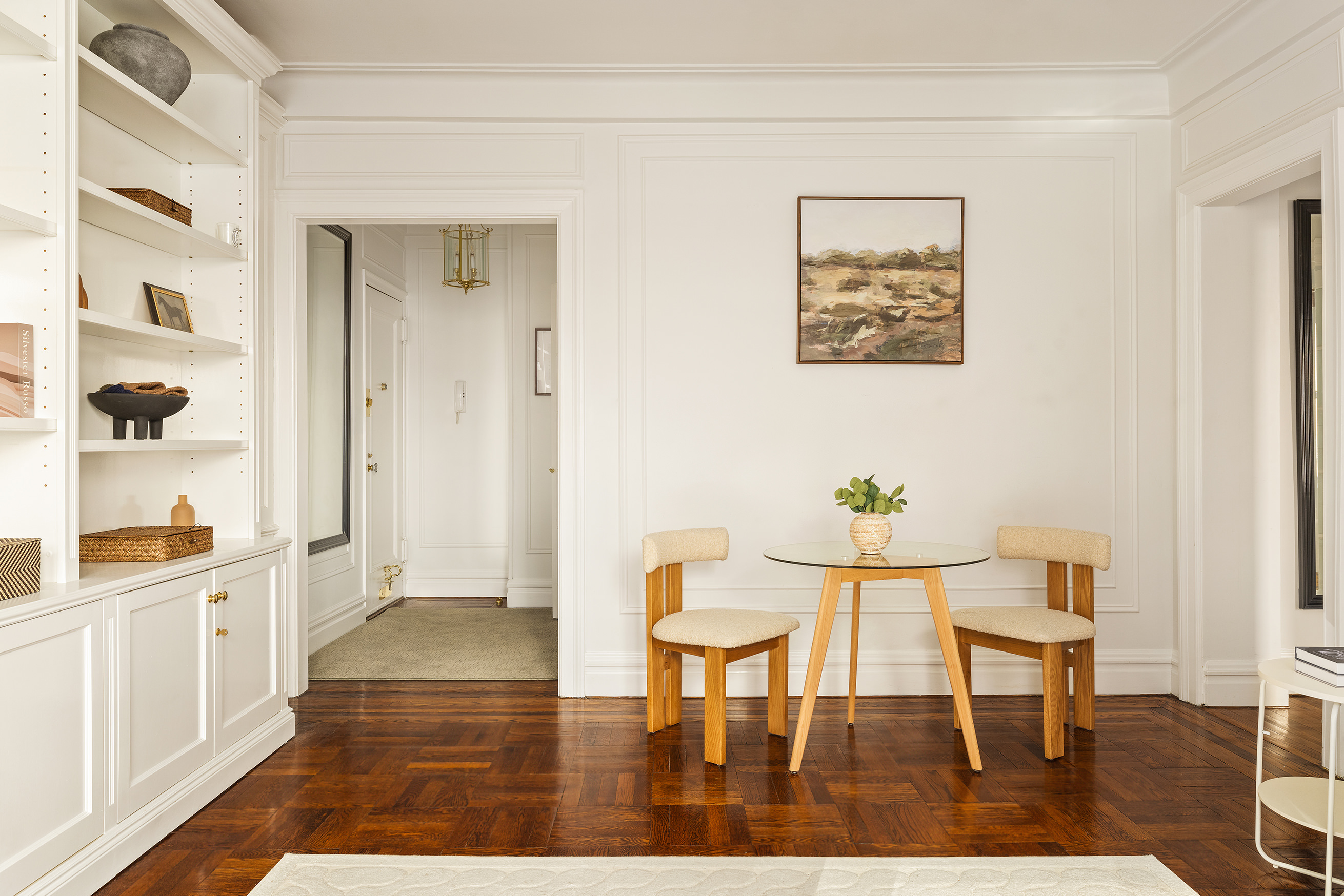 119 East 84th Street, Unit 4C Manhattan, NY 10028 - Photo 2 of 9 a dining room with furniture and wooden floor
