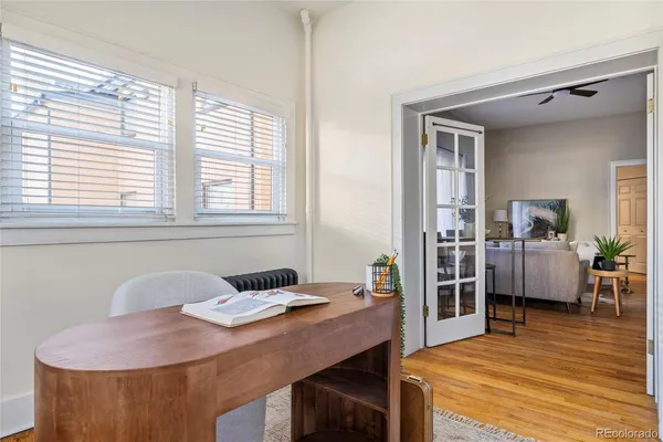 a workspace with furniture and window