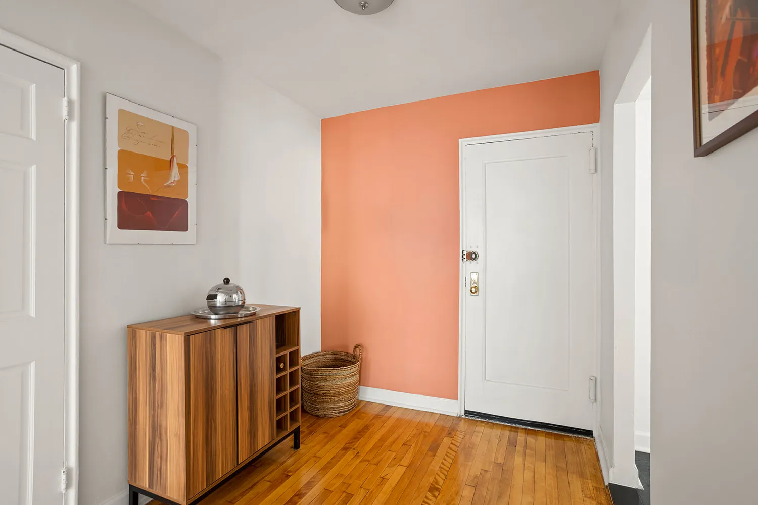 a view of a room with wooden floor and closet