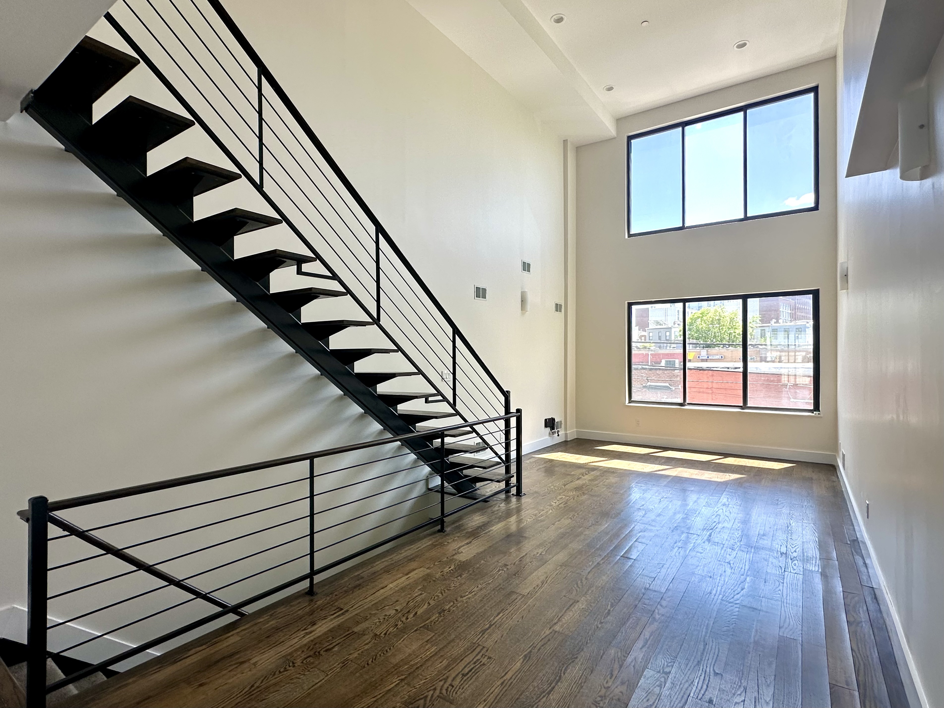 29 MacDougal Street, Unit 2 Brooklyn, NY 11233 - Photo 1 of 14 a view of entryway with wooden floor and stairs