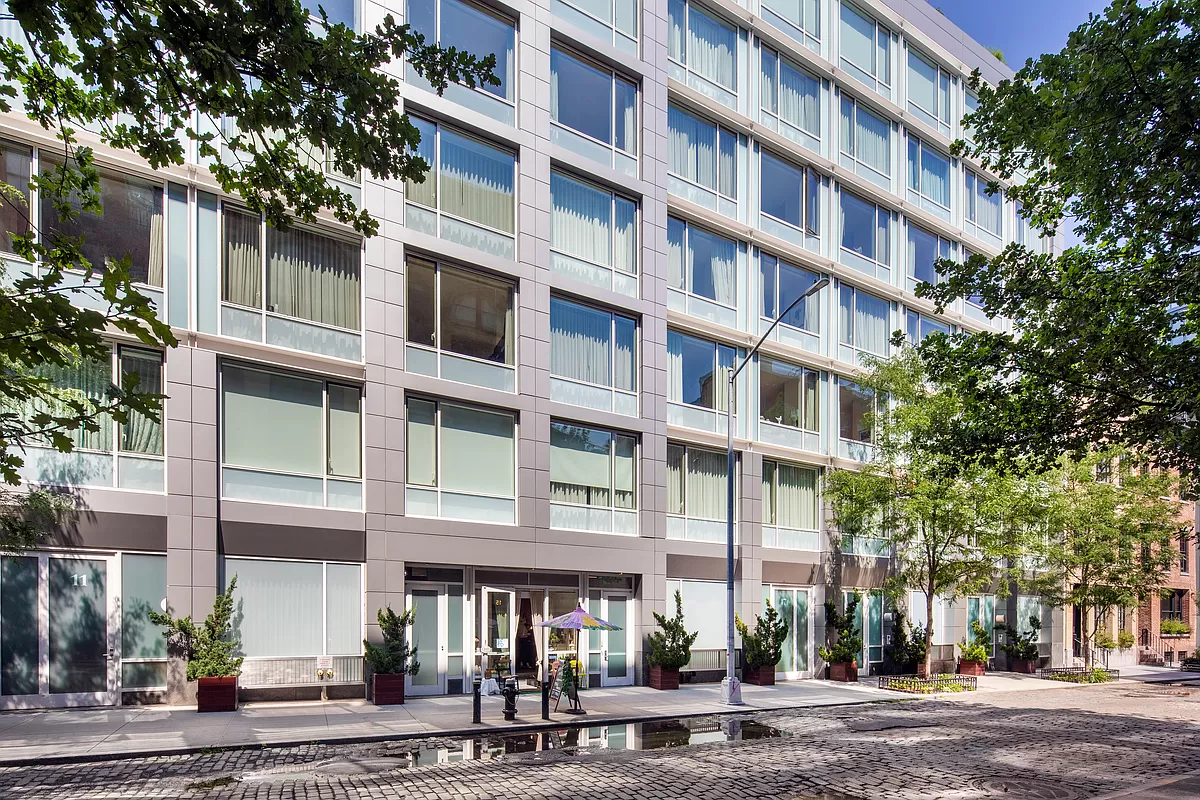 311 West Broadway, Unit 6J Manhattan, NY 10013 - Photo 18 of 19 front view of an apartment building
