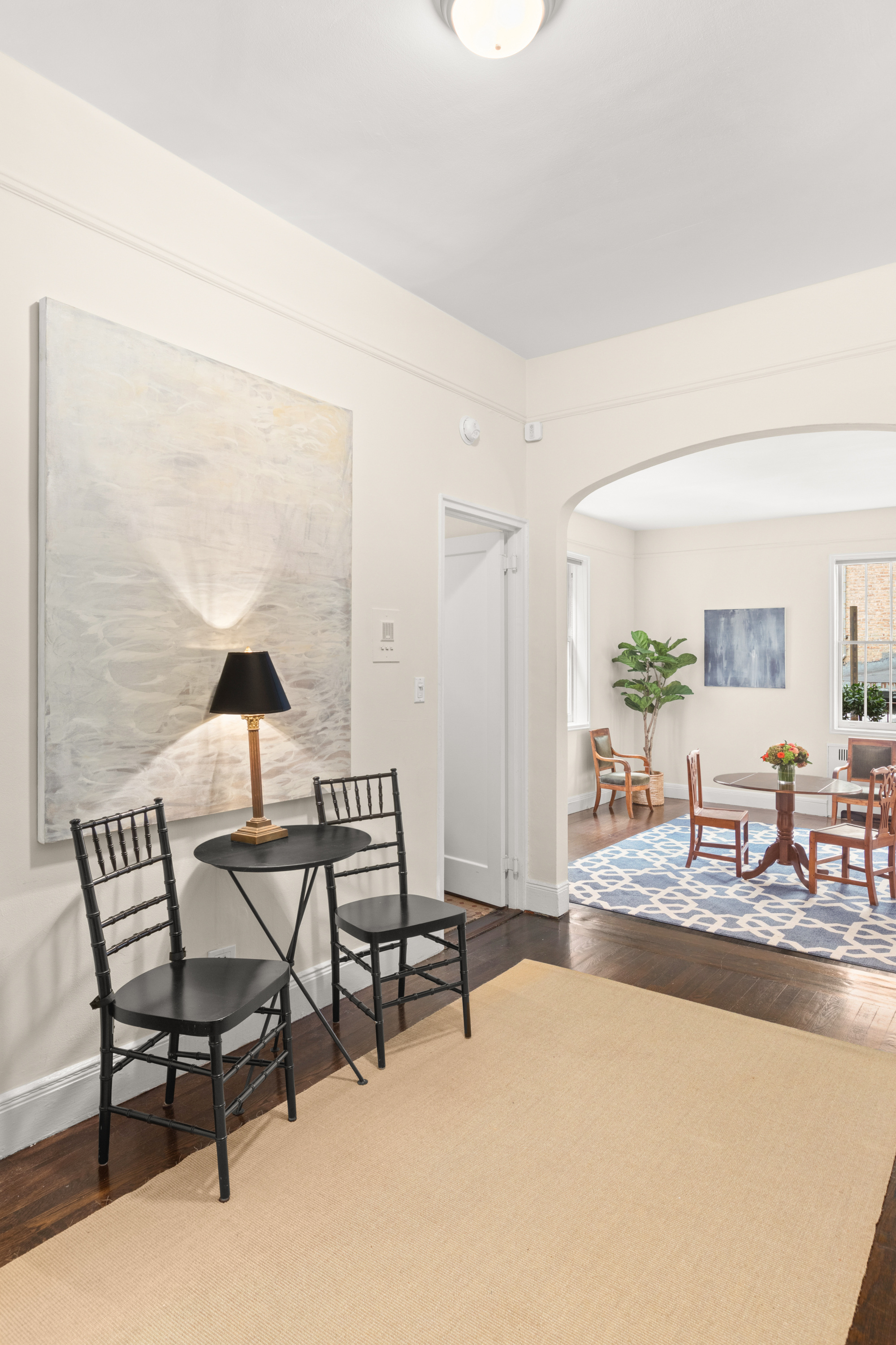51 East 78th Street, Unit 3BC Manhattan, NY 10075 - Photo 17 of 25 a living room with furniture and a potted plant