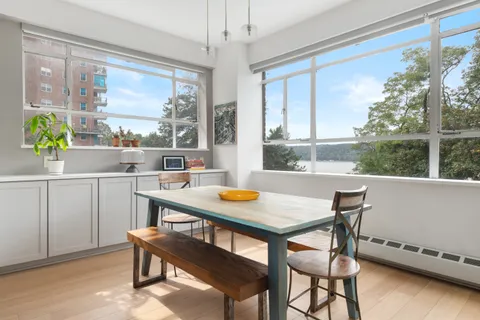 a view of a dining room with furniture window and outside view