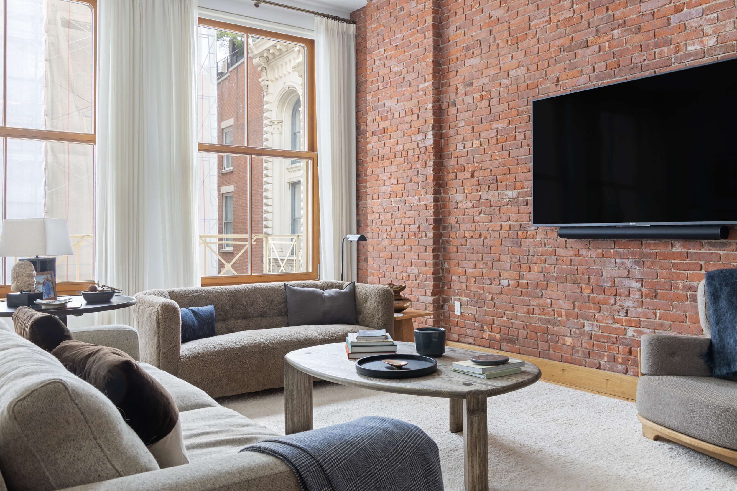 60 White Street, Unit 4E Manhattan, NY 10013 - Photo 3 of 19 a living room with fireplace furniture and a flat screen tv