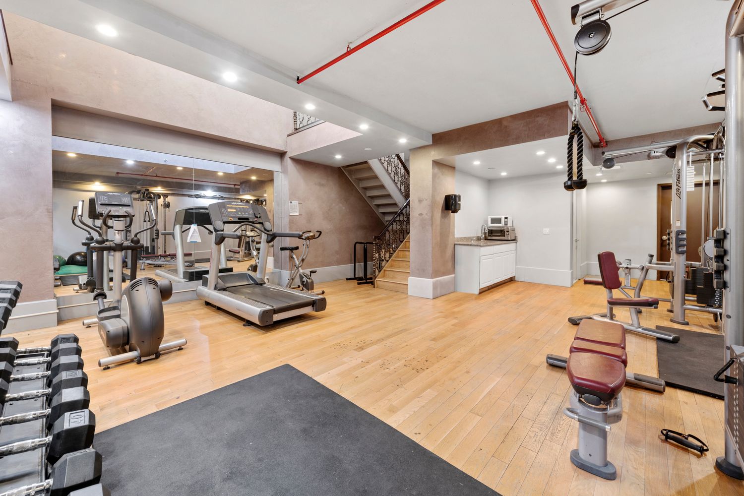 82 Irving Place, Unit 7C Brooklyn, NY 11238 - Photo 14 of 16 a room with lots of chairs and mirrors
