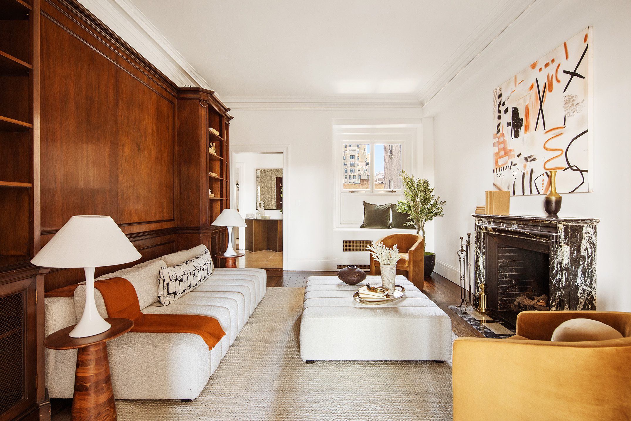 953 5th Avenue, Unit 7/8 Manhattan, NY 10075 - Photo 6 of 15 a living room with furniture a lamp and a window