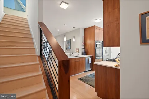 a kitchen with sink and cabinets