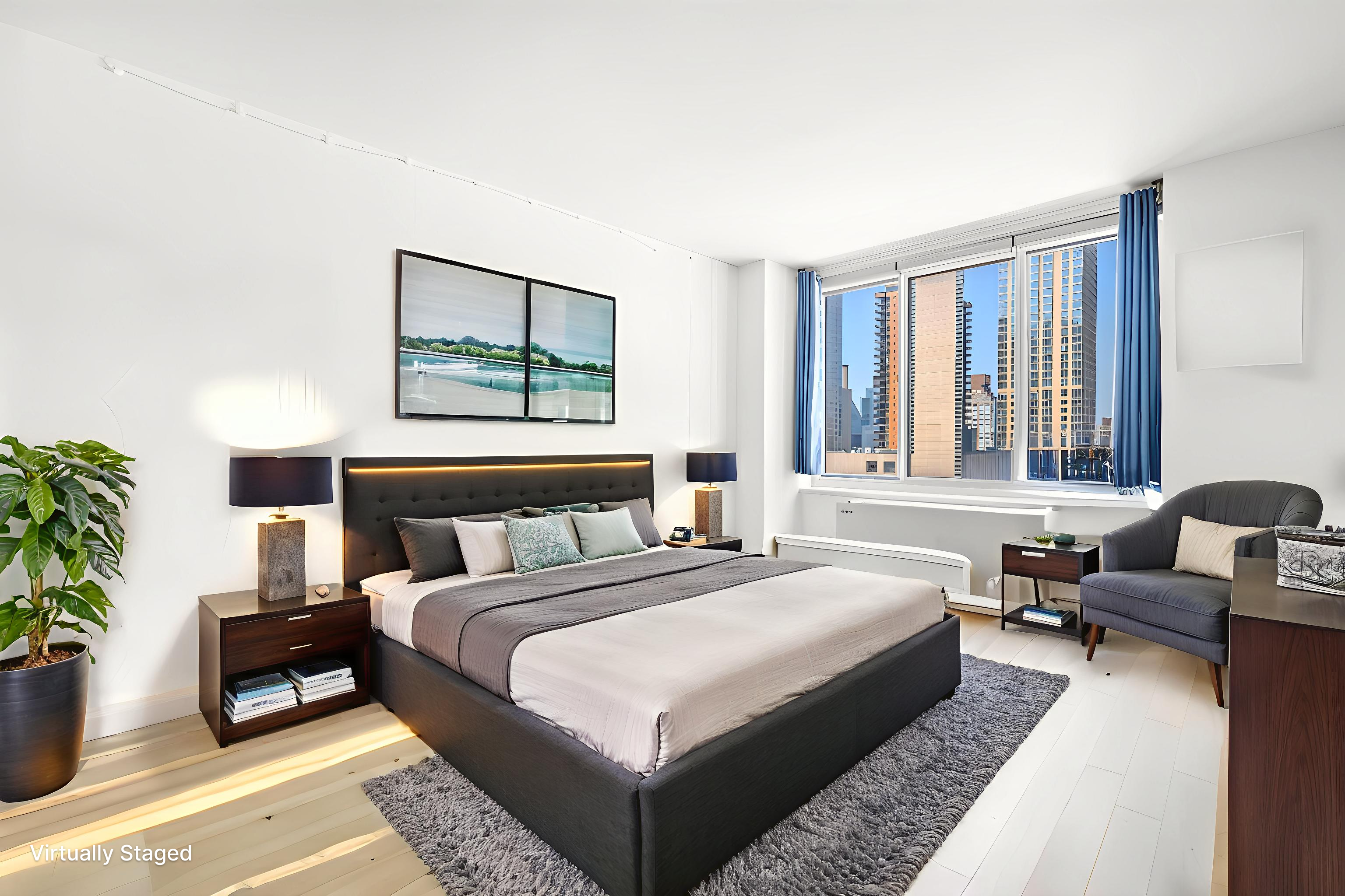 61 West 62nd Street, Unit 17L Manhattan, NY 10023 - Photo 6 of 10 a spacious bedroom with a bed and a couch