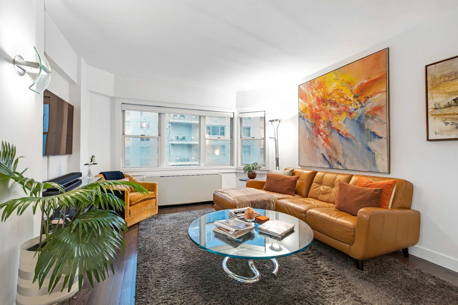 520 East 76th Street, Unit PHC Manhattan, NY 10021 - Photo 4 of 15 a living room with furniture and a large window