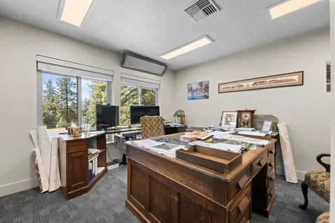 a view of a kitchen with a stove top oven