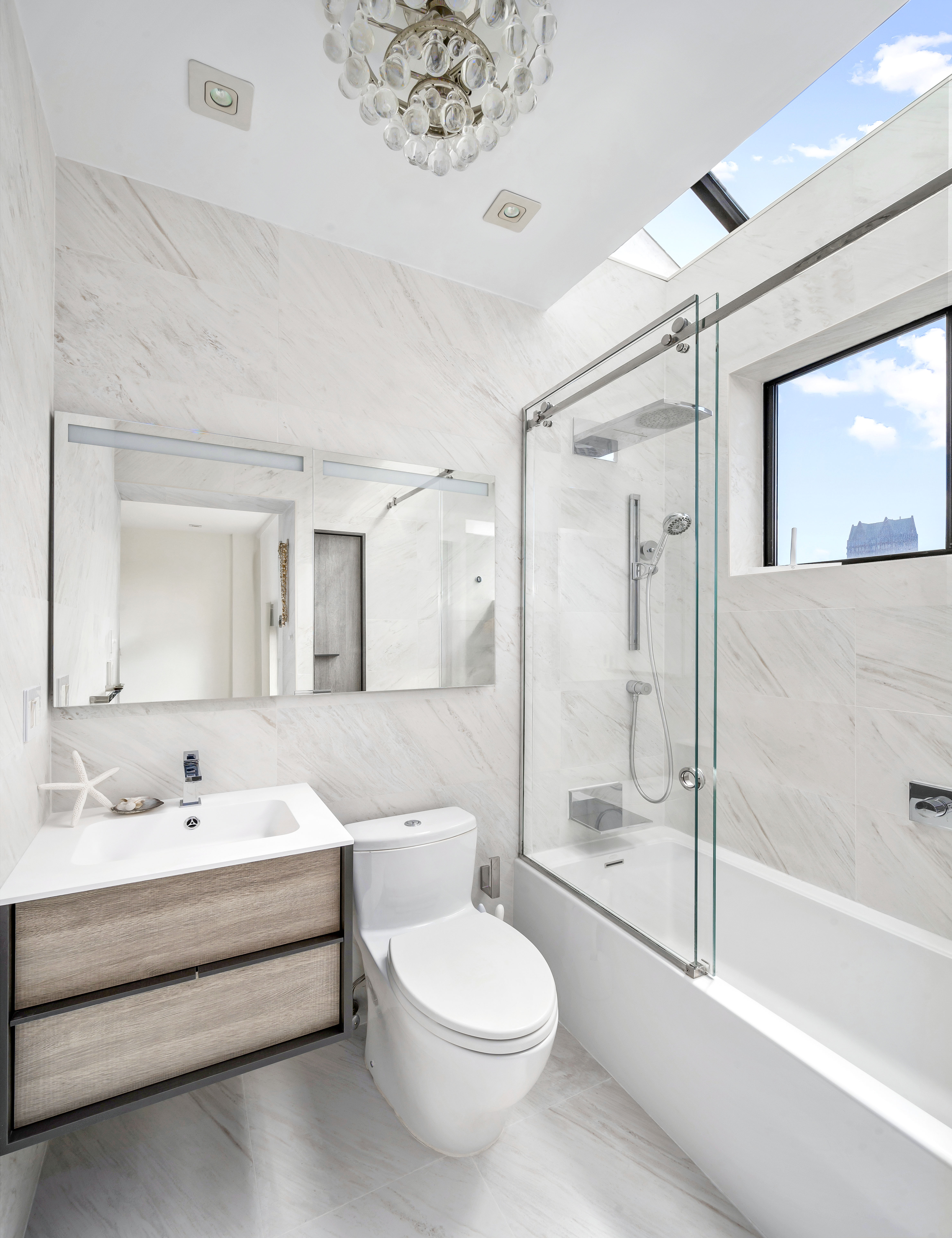 131 East 81st Street, Unit PH15 Manhattan, NY 10028 - Photo 9 of 11 a bathroom with a toilet sink and shower